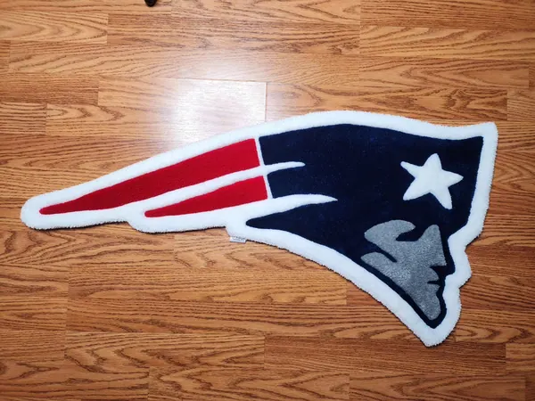 Patriots logo, a hand-tufted rug by Made By Juice