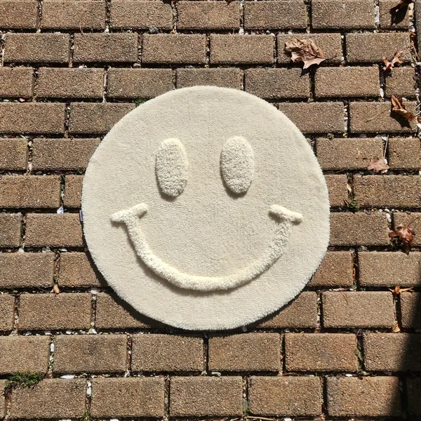 Smile, a hand-tufted rug by Made By Juice