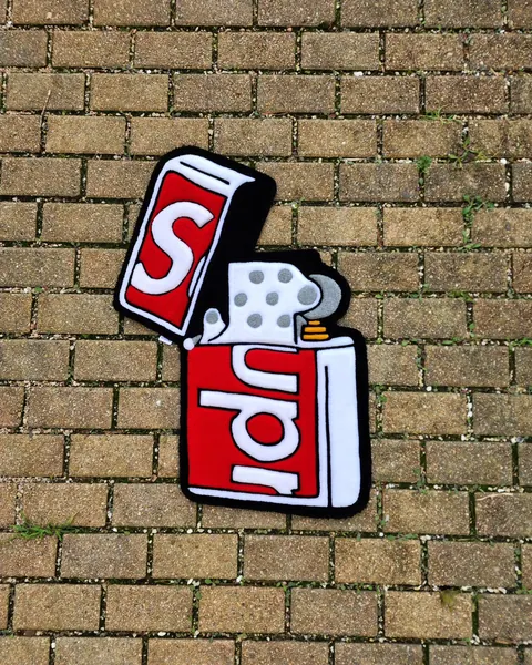 Supreme lighter, a hand-tufted rug by Made By Juice